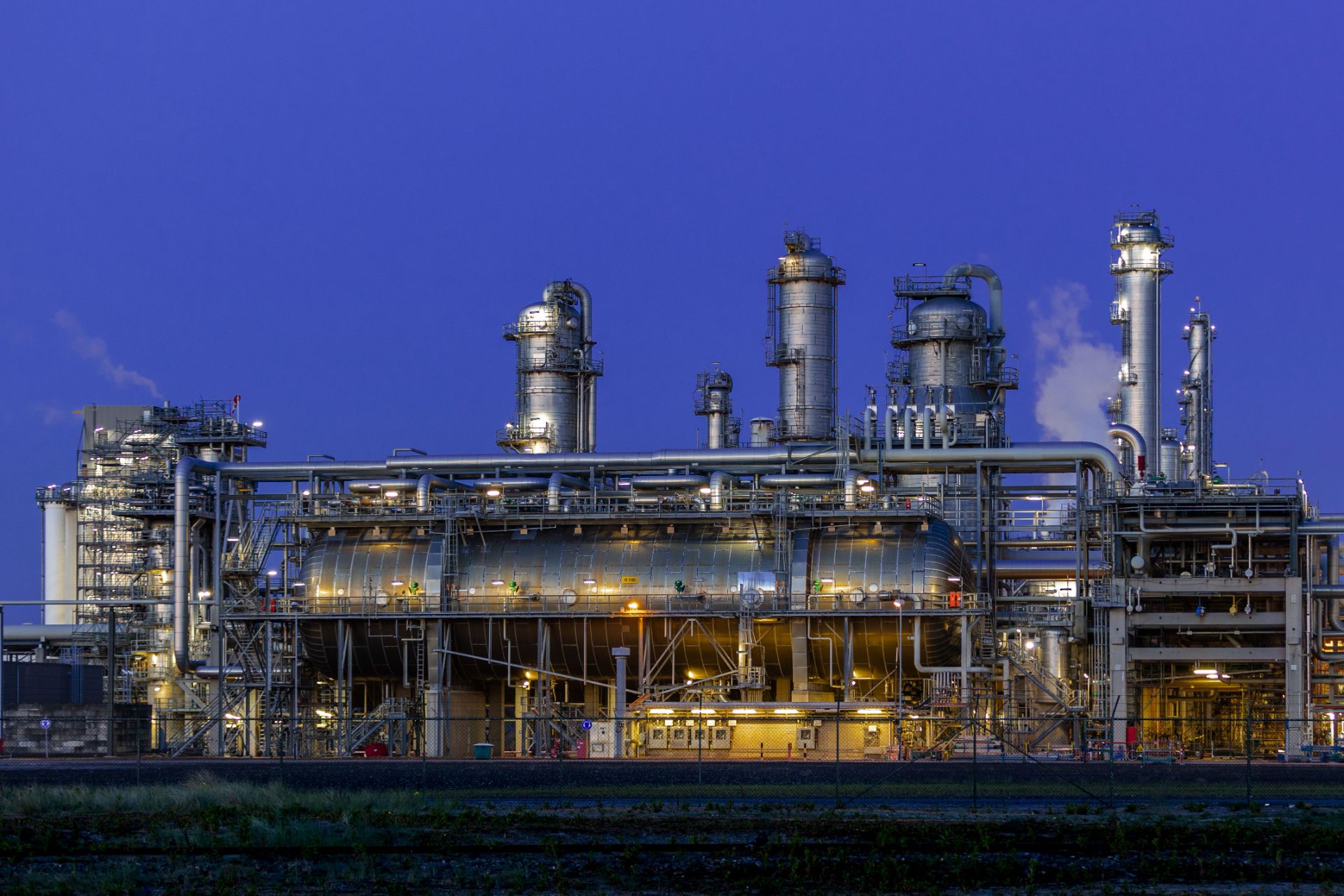 Wellhead and piping manifold at a gas facility